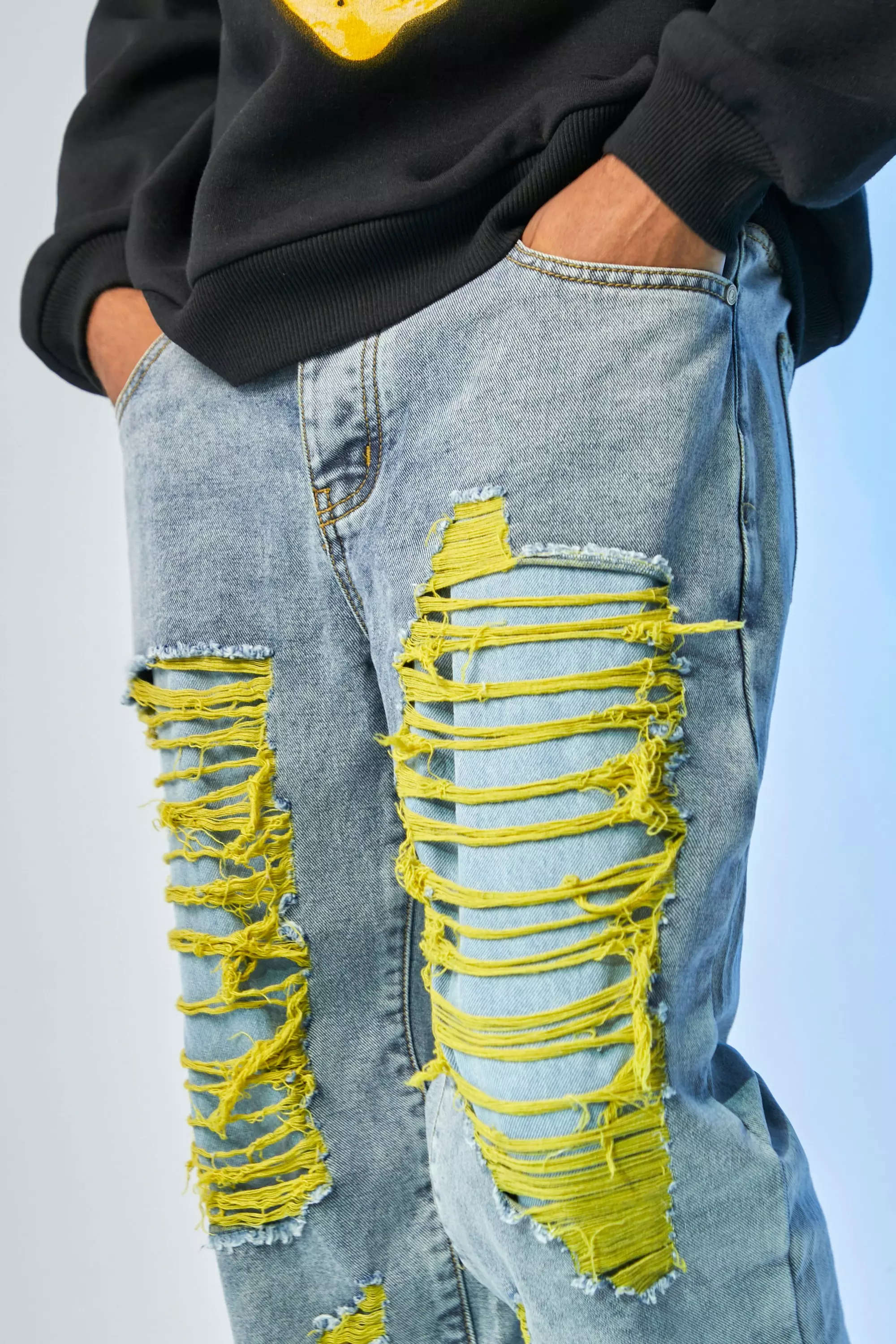 Yellow ripped jeans sales